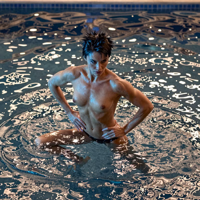 An athletic woman with short, spiky black hair and intense dark eyes in a powerful pose, submerged in a deep, mysterious